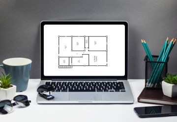 Computador mostrando planta de casa para projetar a decoração de maneira eficiente.